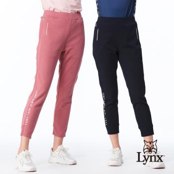 【Lynx Golf】女款彈性舒適混紡材質羅紋褲口造型拉鍊口袋設計窄管九分褲(二色)