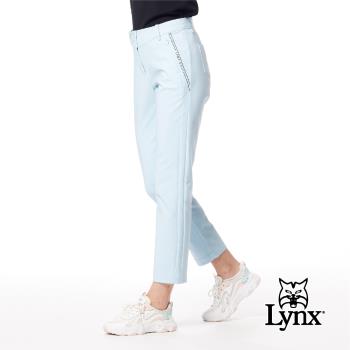 【Lynx Golf】女款彈性舒適腰頭造型兩側脇邊剪裁LOGO膠印隱形拉鍊口袋窄管九分褲-冰藍色