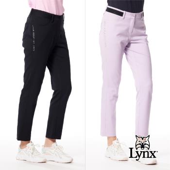 【Lynx Golf】女款日本進口面料環保紗金屬貼膜造型兩側剪接針織帶設計窄管九分褲-黑色